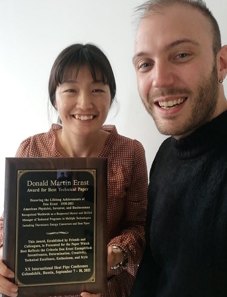 Luca and Naoko with award plaque